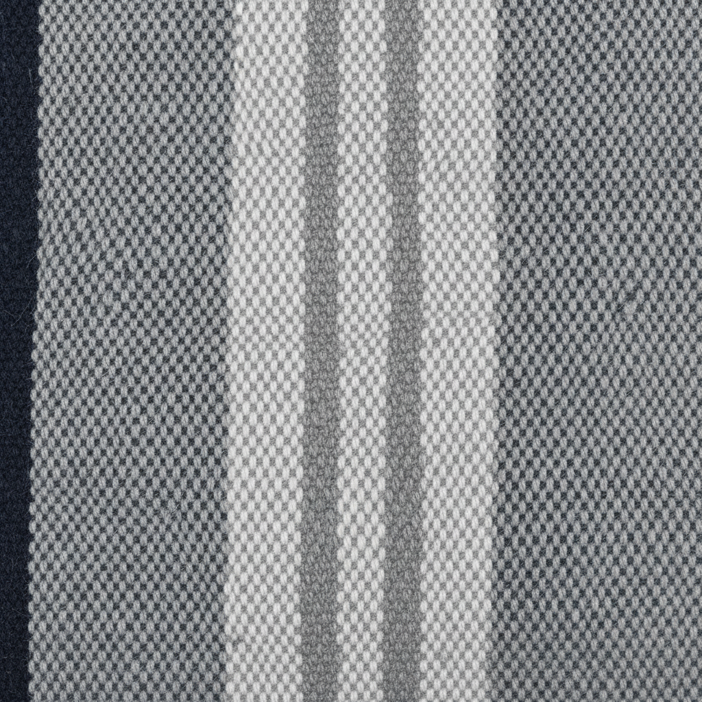 Close-up of navy blue and gray woven cotton stripe fabric texture on the Atlantic Striped Lumbar Pillow